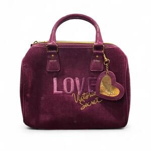 Y2K Victoria’s Secret purple velour handbag with gold hardware.